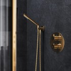 Omnires kolanko do słuchawki prysznicowej złoty połysk T87GL