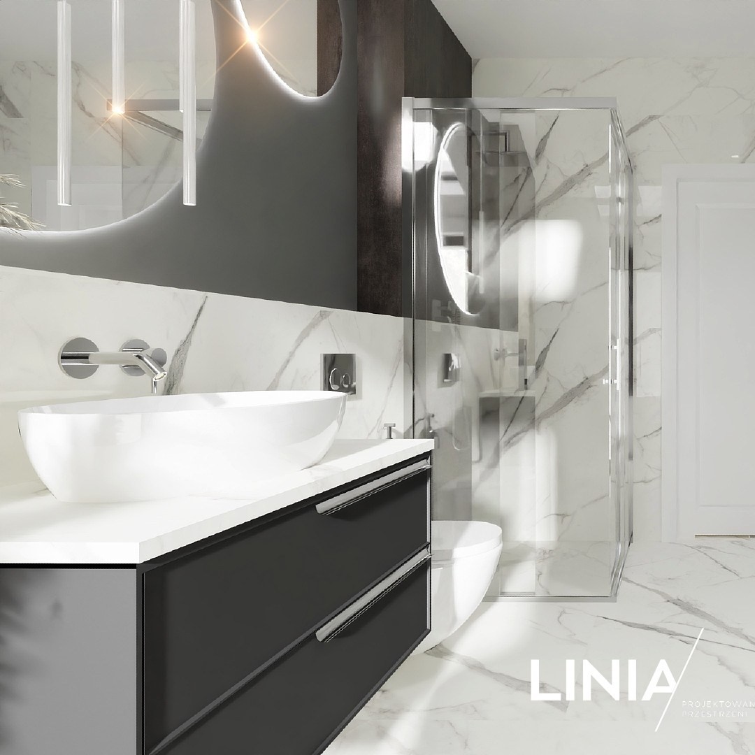 Biały marmur w towarzystwie wanny wolnostojącej oraz kabiny prysznicowej! 