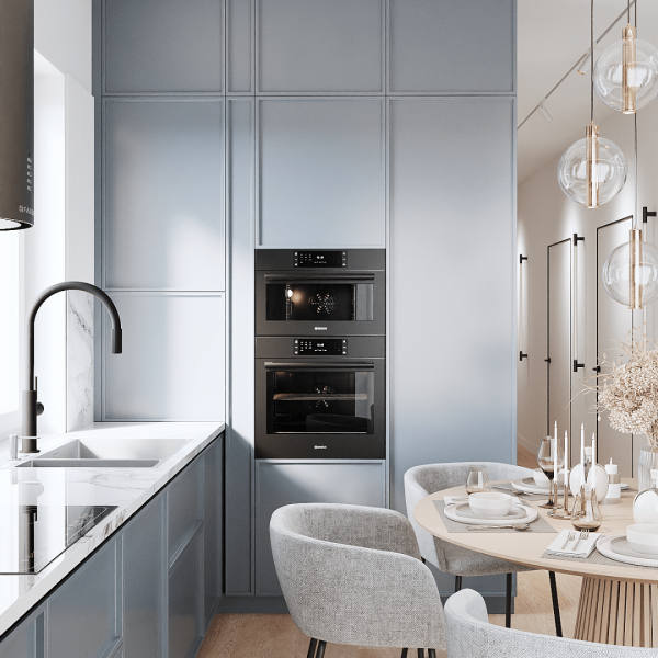 Nowoczesny zlewozmywak wpuszczany w blat z elegancką czarną baterią kuchenną