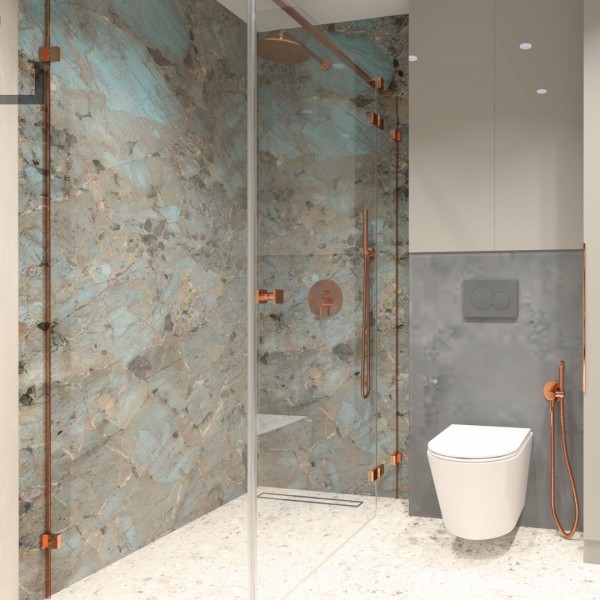 Łazienka z owalną umywalką nablatową i marmurową ścianą – inspiracje do aranżacji