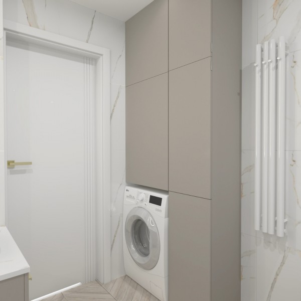 Nowoczesna łazienka z marmurowymi płytkami i złotymi bateriami – aranżacja z klasą