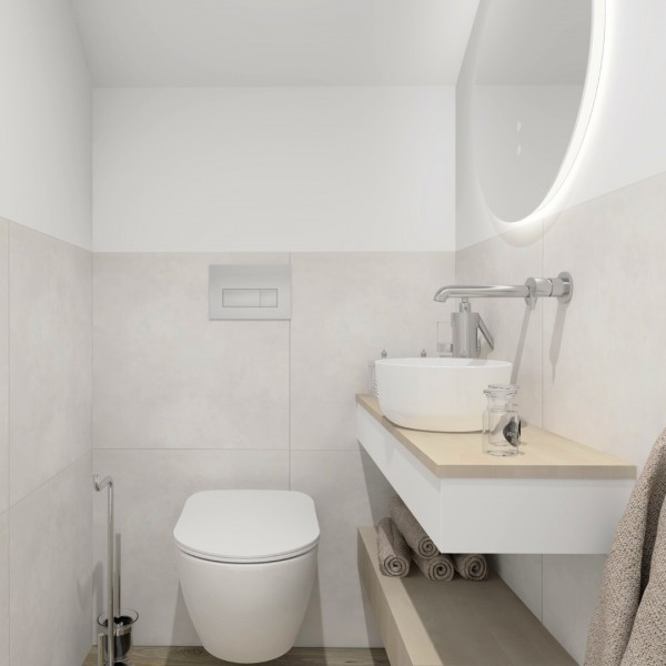 Nowoczesna toaleta z umywalką nablatową i minimalistycznym wykończeniem