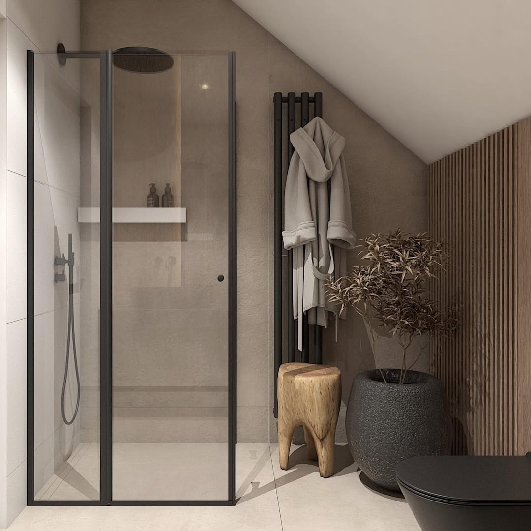 Łazienka na poddaszu z zestawem podtynkowym Geberit i czarną ceramiką